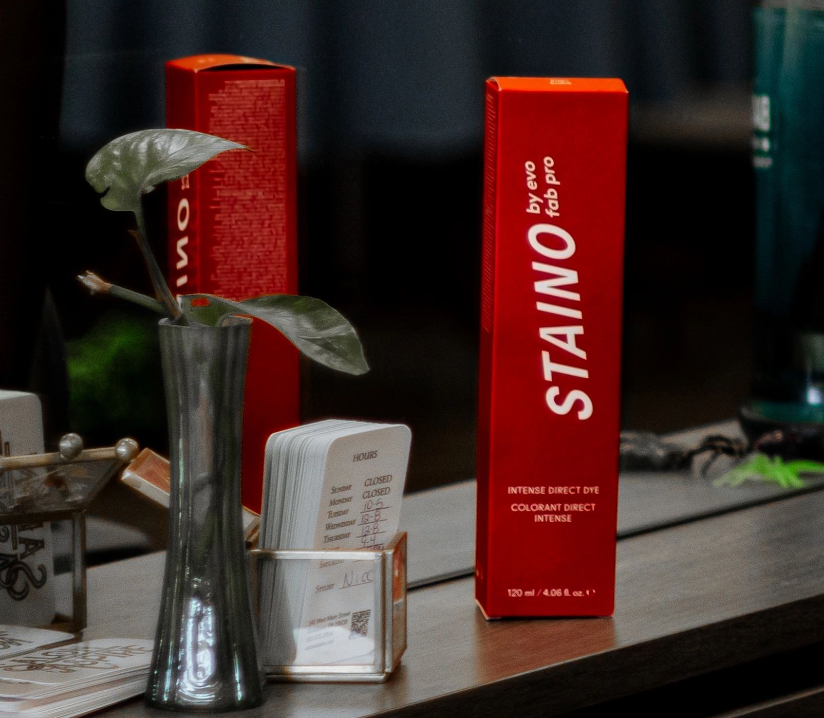 A red STAINO Fashion Color Box resting on one of our hair stations.