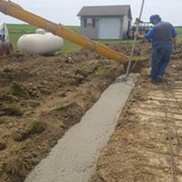 Pouring concrete for footers we dug.