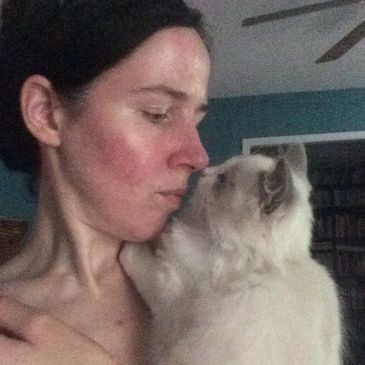 Kristy Marson, breeder/owner of Genotype Cats - Ragdoll Cats, nose-to-nose with a blue bicolor kitty