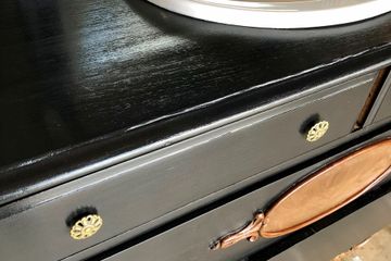 refinished antique dresser repurposed for bathroom renovation