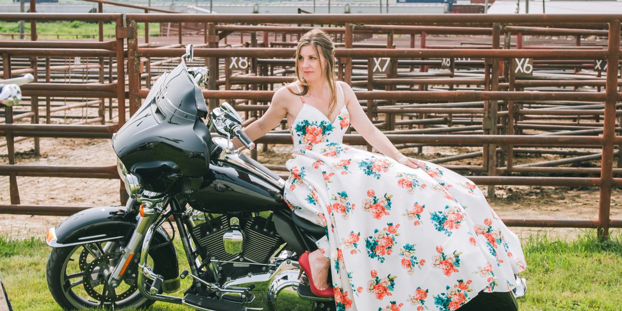 Formal gown on motorcycle.