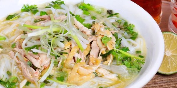 Fresh boneless chicken noodle soup pho with spring onions and cilantro 