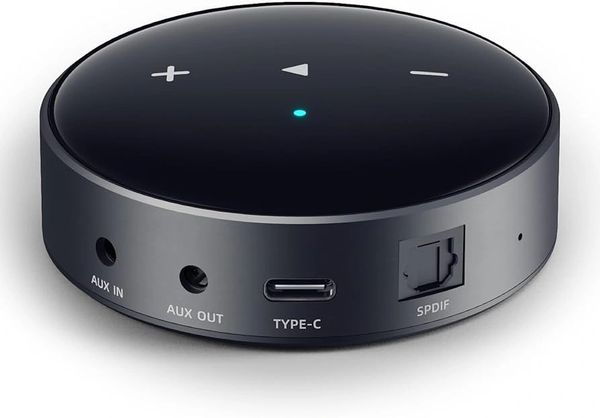 Compact black audio converter with multiple ports.