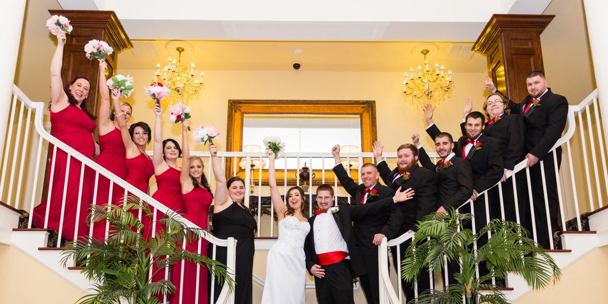 Wedding Party on both sides of the Stair Case having a blast with Hollywood