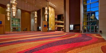 Colorful hotel carpet newly cleaned and disinfected by a professional carpet cleaning company.
