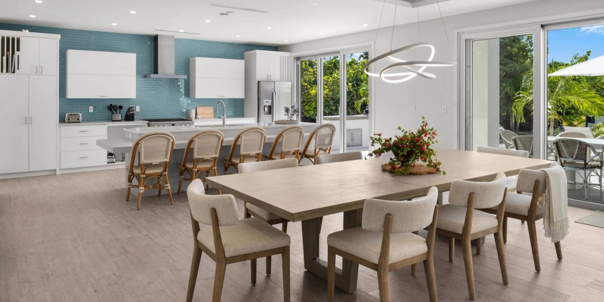 Modern open kitchen and dining area with natural light.