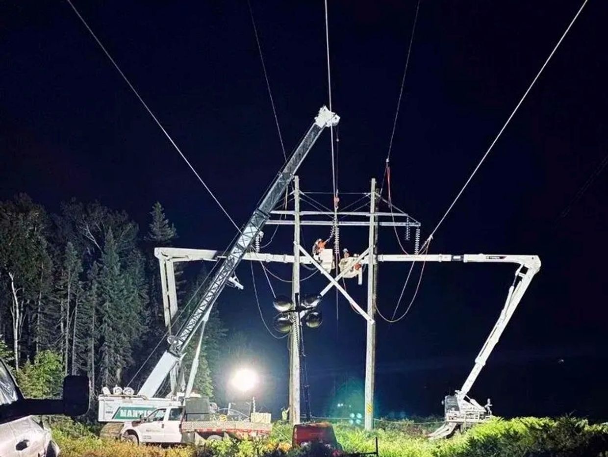 Mantis 8012 works on powerlines at night in New Brunswick, Canada.