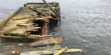 A wharf suffers severe damage from a ferry.