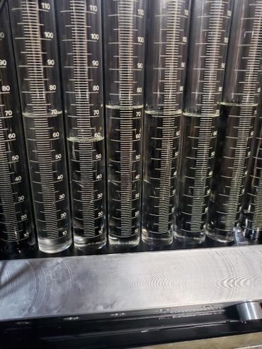 Measuring beakers for balance and flow testing injectors up to 8 at a time.