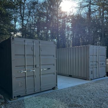 <img alt= "photo of 20 foot containers on concrete pad in a backyard" src="hq.jpg">