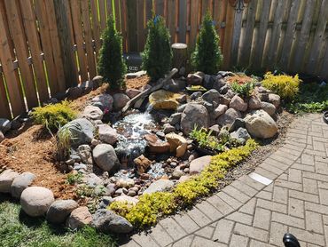 A pondless waterfall offers several benefits, making it a popular choice for many homeowners and lan