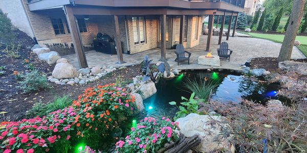 Creating staycations one home at a time with a Unilock Paver Patio and Aquascape Koi Pond!