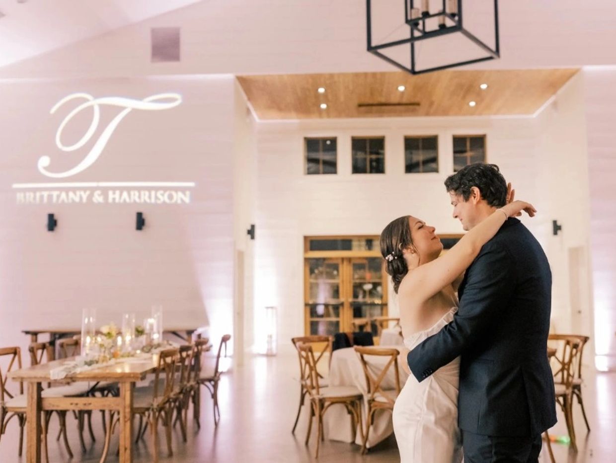 Newlyweds in a loving embrace during their wedding.
