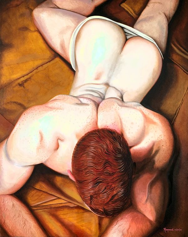 Top view of a muscular man with red hair lying on a brown surface.