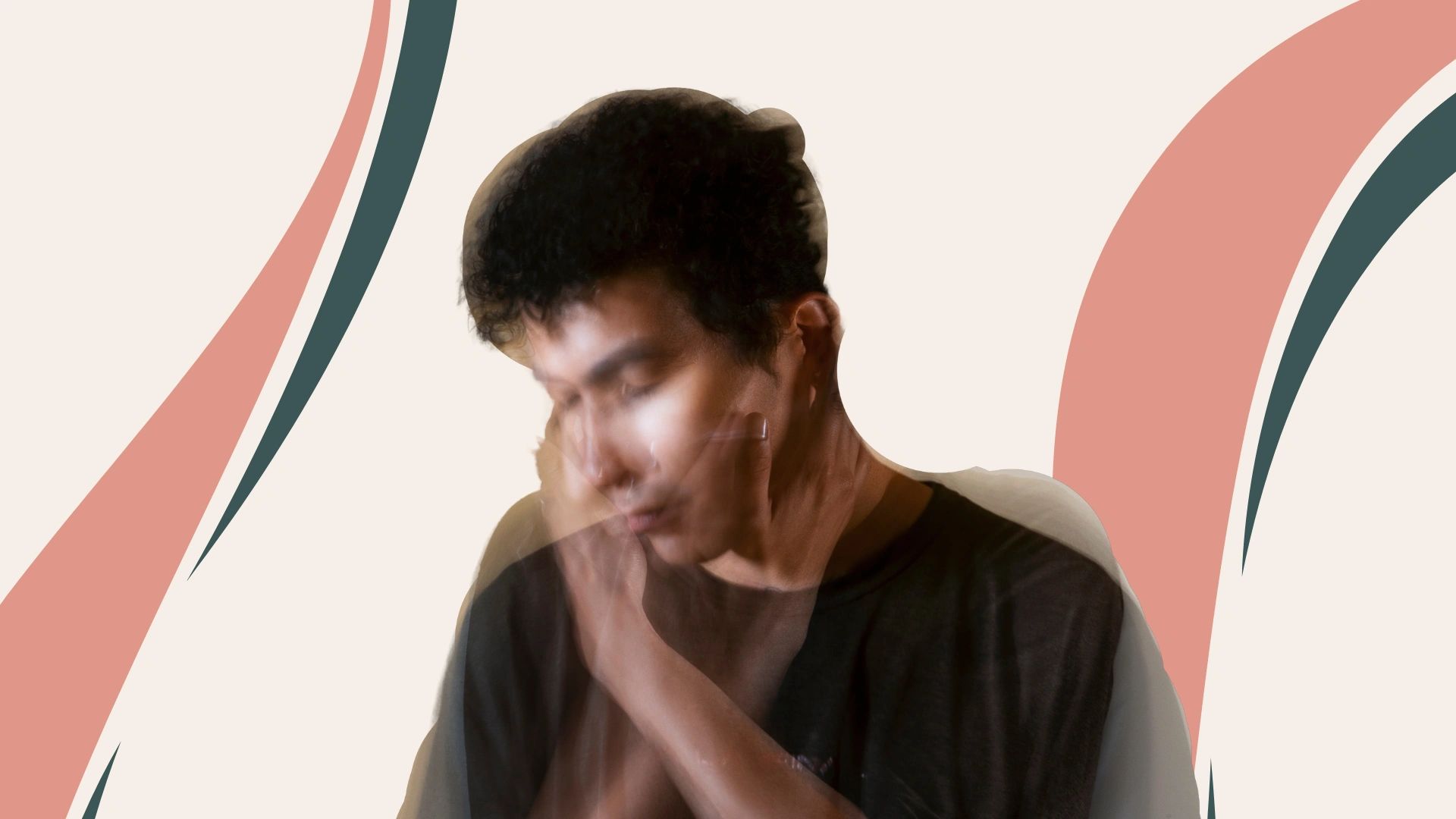 Blurry image of a person holding their face with abstract background.