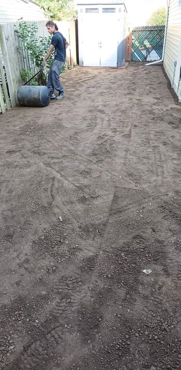 Professional site grading and soil leveling for a new sod lawn in Avon, OH.