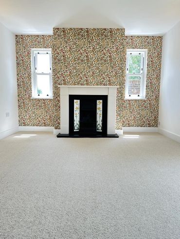 Floral Patterned Wall Paper compliments stunning New Romney Wool Carpet.