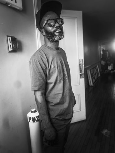 A Haitian musician name Rony Raymond posing for a picture while performing with Rara Bel Poze