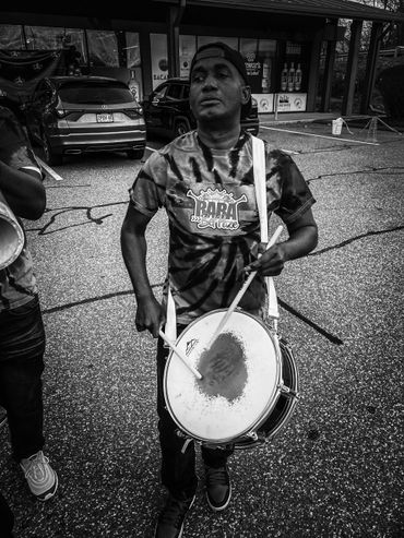 Renauld Casimir a Haitian musician of Rara Bel Poze playing the drums