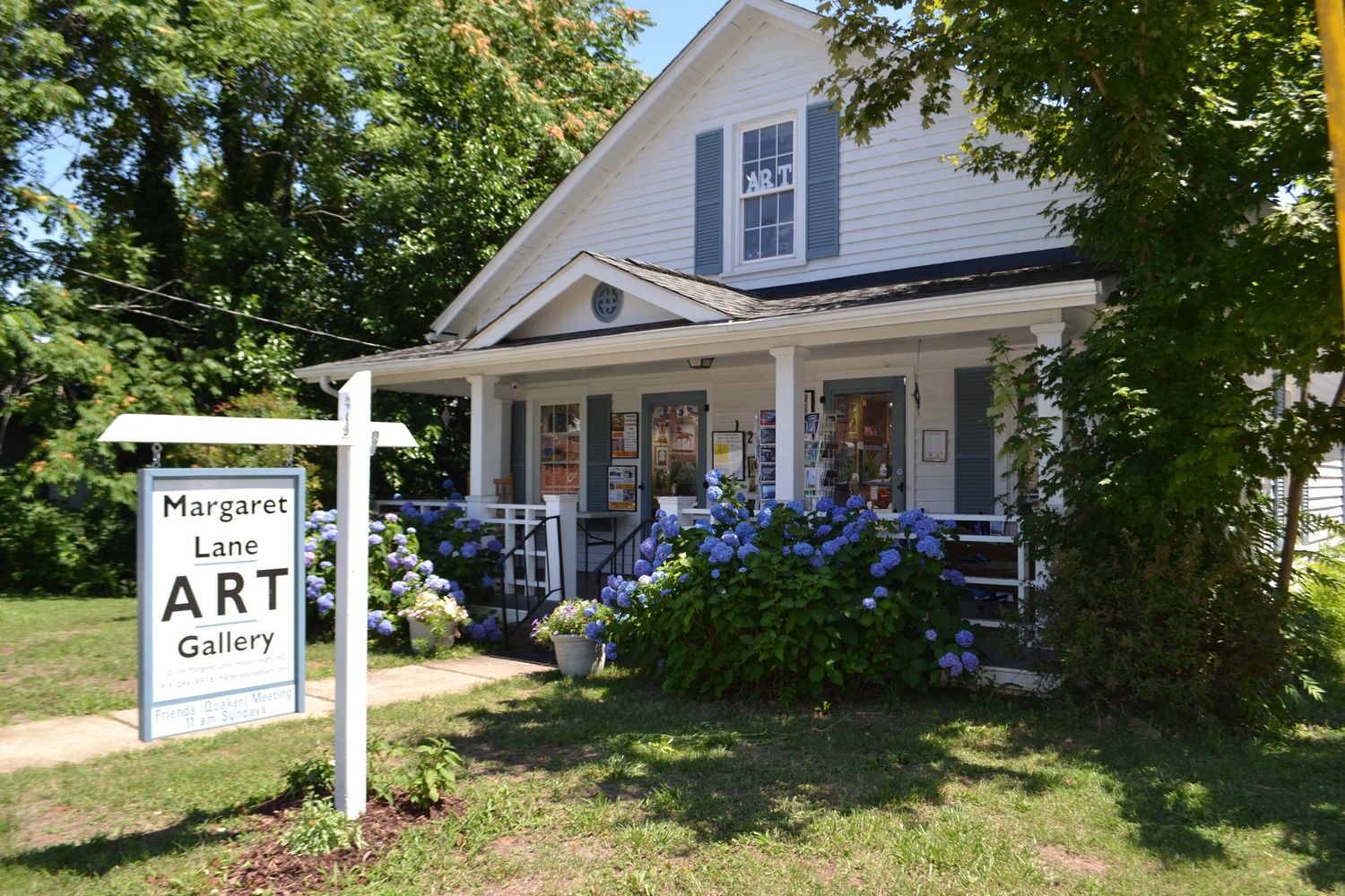 Margaret Lane Gallery, street view, in the spring when the hydrangeas are blooming. 