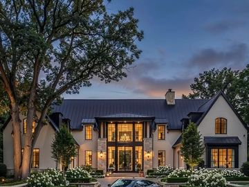 Elegant modern estate with white stucco and black accents.