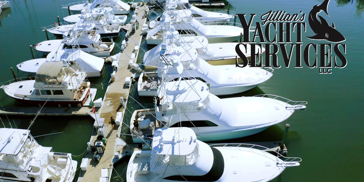 Aerial view of yachts docked with company logo overlay.