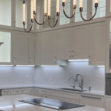Custom kitchen cabinets with unique and elegant lighting 