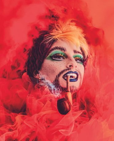 Close-up portrait highlighting detailed drag makeup & emotion through eyes, fine art storytelling