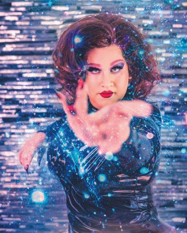 Drag performer in glittering costume and expressive makeup, portrait by Becky Hinch