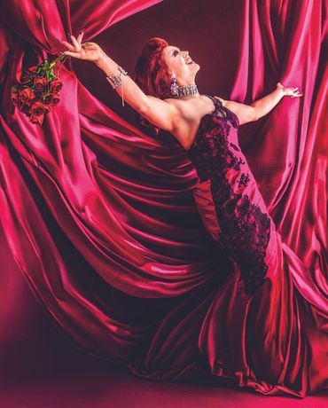 Fine art portrait of drag performer in dramatic makeup and flowing gown, photographed by Becky Hinch
