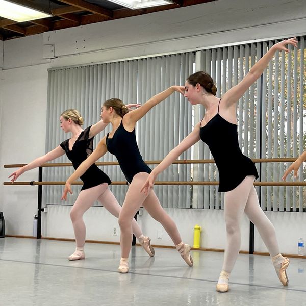 Cuizon Ballet Centre Balanchine Dancers. Three ballet students in a diagonal line in pointe shoes