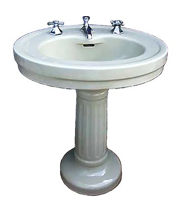 Antique pedestal bathroom sink.