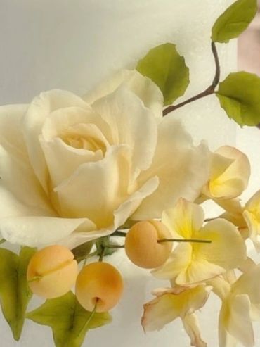 Sugar rose and green stems on anniversary cake Dublin bakery