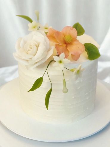 Edible flowers on single tier cake