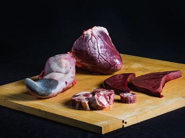 Liver, Kidney, Oxtail, Heart & Tongue on chopping board. Born & reared in Malpas.
