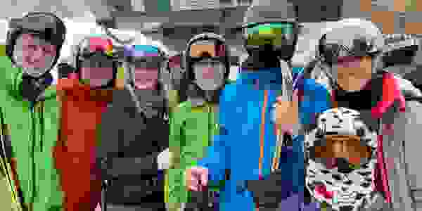 Ski tuning family smiling at ski resort