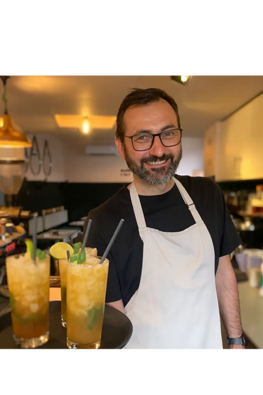 Barista serving cocktails at an evening event at Coffee Crowd at 41 High Street in Newport Pagnell.