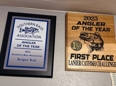 Wall awards for 2023 angler achievements.