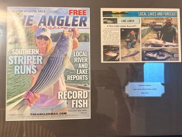 Framed magazine cover and article about record fish catches.