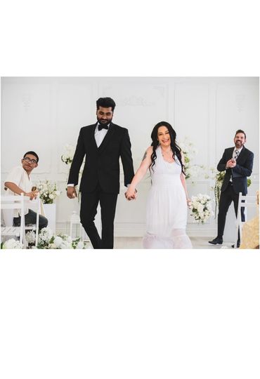The bride holding the hand of the groom