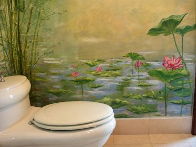 Bathroom with lotus flower mural and white toilet.