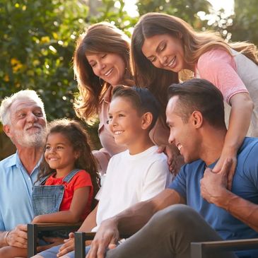 Speech therapy for all ages. Grandparents, parents, and children posed for a group picture, laughing