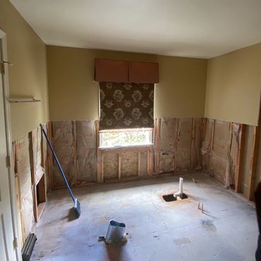Smooth clean cut in the drywall where the tile line used to be. Bath tub & shower demolished.