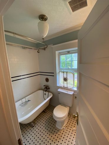 Before clawfoot tub bathroom demo and removal. Small tile floor demolished as well.