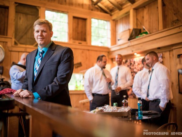 groom and grooms men standing in building on wedding day