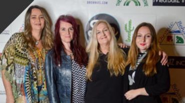 4 women in front of Worldwide Women's Film Festival step and repeat