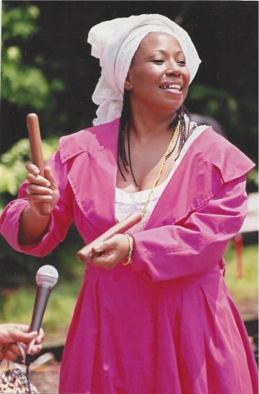 Mignon Grayson playing the "Claves". The heartbeat of Afro-Caribbean music