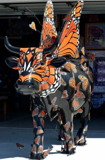 Moo Monarch life size cow for Cow Parade SLO by artist Deprise Brescia for the city of Pismo Beach