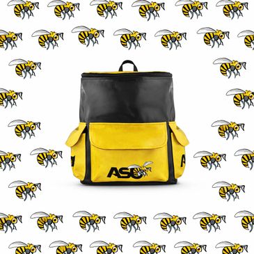 Black and yellow ASU backpack with bee logos on a bee-patterned background.