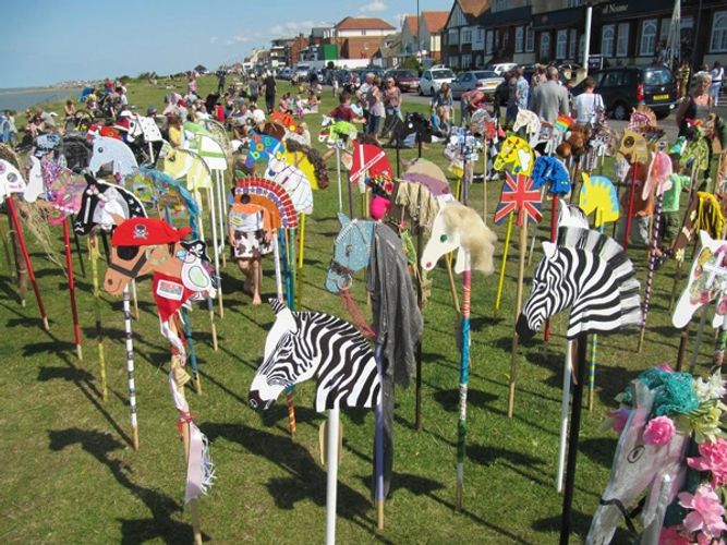 Hobby Horse or Stick horses gathering for an Event at the seaside.